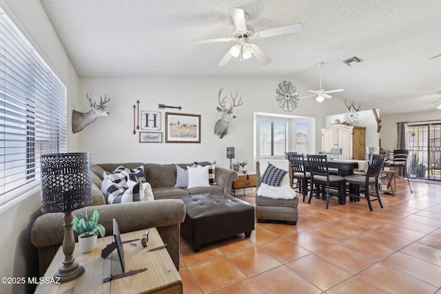 1861 W Sauvignon Dr, Tucson, AZ 85746 - living area with ceiling fan, light tile patterned floors, a textured ceiling, and lofted ceiling