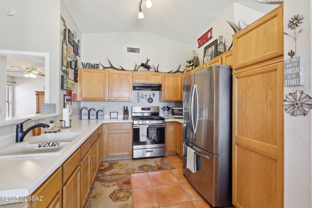 1861 W Sauvignon Dr, Tucson, AZ 85746 - kitchen featuring appliances with stainless steel finishes, a sink, under cabinet range hood, light countertops, and ceiling fan