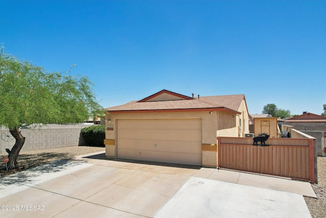 1861 W Sauvignon Dr, Tucson, AZ 85746 - ranch-style home featuring stucco siding, concrete driveway, fence, a gate, and an attached garage
