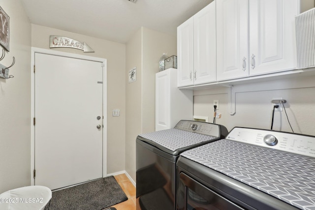 1861 W Sauvignon Dr, Tucson, AZ 85746 - laundry room featuring cabinet space, independent washer and dryer, light wood-style floors, and baseboards