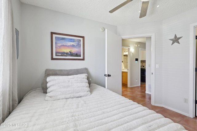1861 W Sauvignon Dr, Tucson, AZ 85746 - tiled bedroom with a ceiling fan, connected bathroom, baseboards, and a textured ceiling
