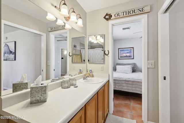 1861 W Sauvignon Dr, Tucson, AZ 85746 - bathroom with tile patterned flooring, vanity, and ensuite bath