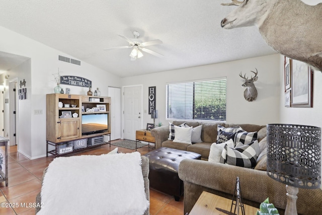 1861 W Sauvignon Dr, Tucson, AZ 85746 - living area featuring a ceiling fan, tile patterned floors, lofted ceiling, and a textured ceiling