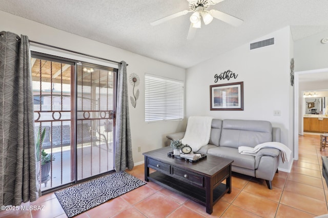 1861 W Sauvignon Dr, Tucson, AZ 85746 - tiled living area featuring a ceiling fan, a textured ceiling, lofted ceiling, and baseboards