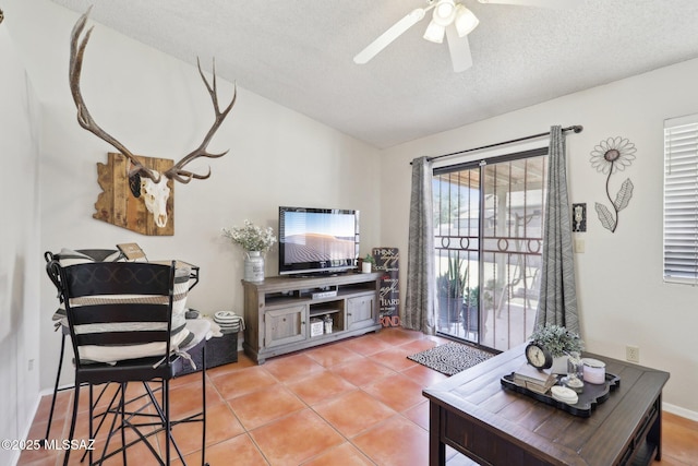 1861 W Sauvignon Dr, Tucson, AZ 85746 - living room featuring vaulted ceiling, a ceiling fan, a textured ceiling, and tile patterned floors
