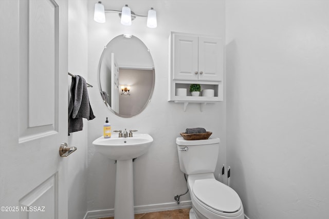 9451 S Via Bandera, Vail, AZ 85641 - bathroom with toilet, baseboards, and a sink