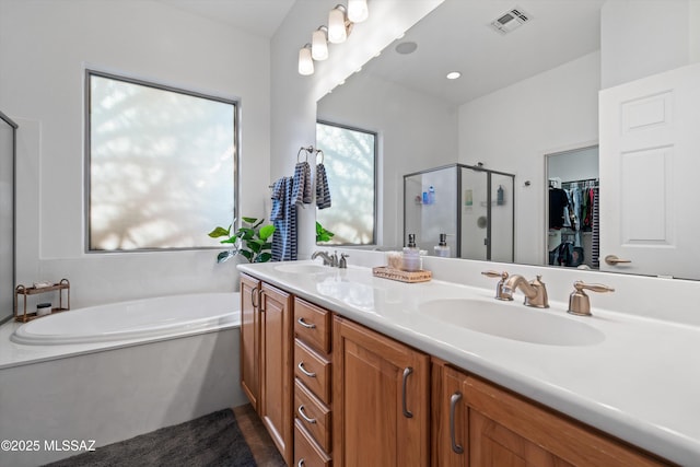 9451 S Via Bandera, Vail, AZ 85641 - full bath featuring a shower stall, a bath, double vanity, and a spacious closet