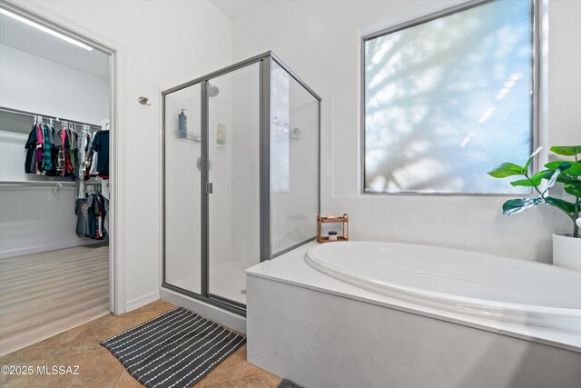 9451 S Via Bandera, Vail, AZ 85641 - full bath featuring a stall shower, a bath, a spacious closet, and tile patterned floors