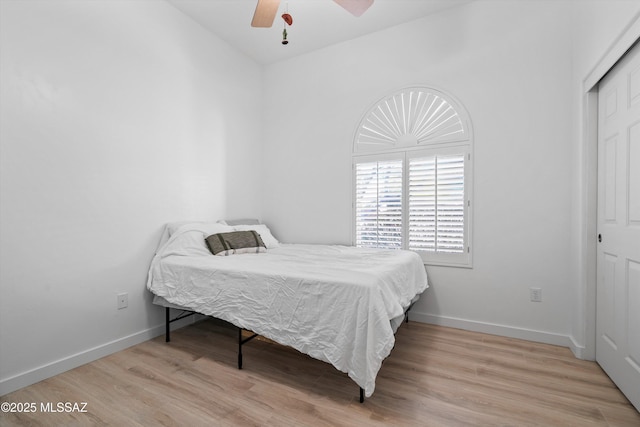 9451 S Via Bandera, Vail, AZ 85641 - bedroom with light wood finished floors, baseboards, a closet, and a ceiling fan