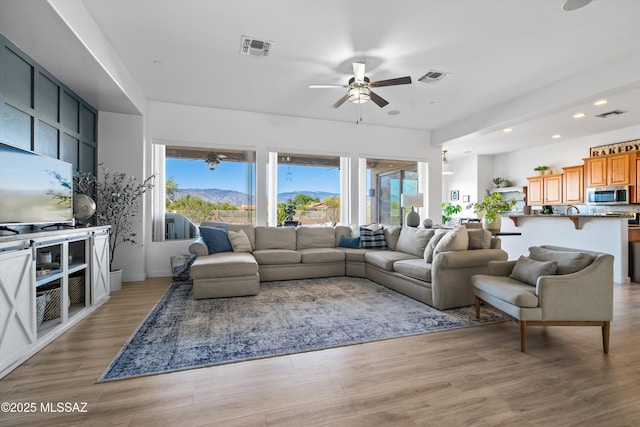 9451 S Via Bandera, Vail, AZ 85641 - living area with a ceiling fan, plenty of natural light, recessed lighting, and light wood-type flooring