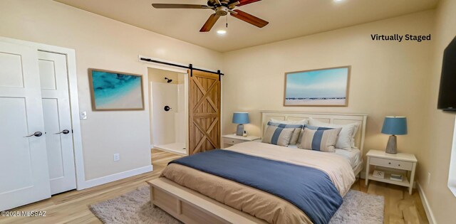 352 W Lee Trl, Safford, AZ 85546 - bedroom featuring a barn door, light wood finished floors, baseboards, and recessed lighting