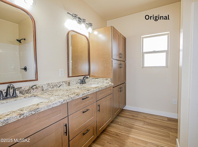 352 W Lee Trl, Safford, AZ 85546 - full bath featuring wood finished floors, baseboards, double vanity, and a shower