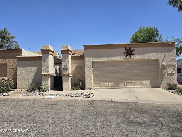2802 W Carnation Pl, Tucson, AZ 85745 - adobe home featuring stucco siding, an attached garage, and driveway