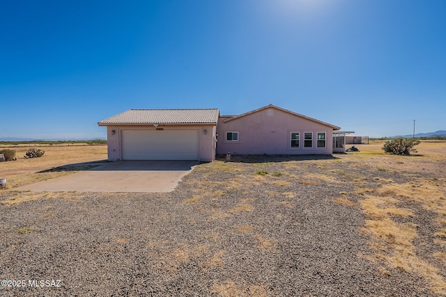1176 W Trigger Ln, Cochise, AZ 85606 - view of front of house featuring driveway, a tile roof, stucco siding, and an attached garage
