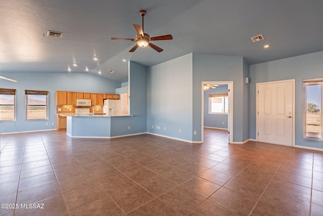 1176 W Trigger Ln, Cochise, AZ 85606 - unfurnished living room with ceiling fan, dark tile patterned floors, a sink, vaulted ceiling, and baseboards