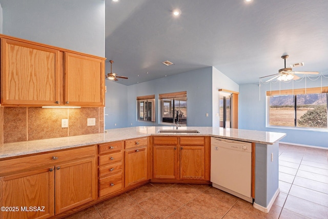 1176 W Trigger Ln, Cochise, AZ 85606 - kitchen with white dishwasher, ceiling fan, a sink, vaulted ceiling, and light tile patterned flooring