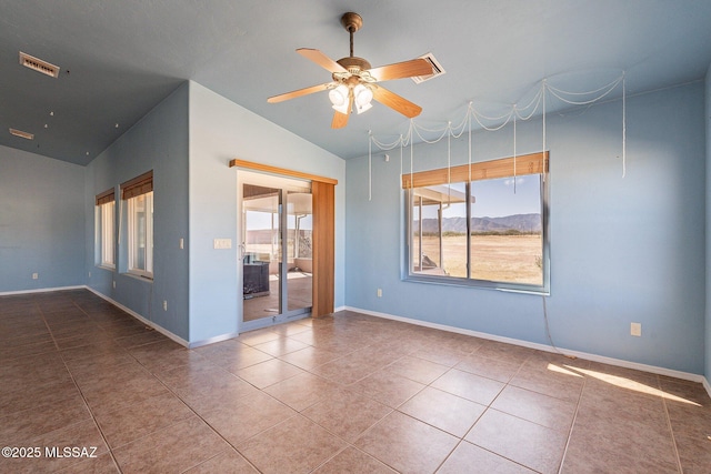 1176 W Trigger Ln, Cochise, AZ 85606 - empty room with vaulted ceiling, a ceiling fan, baseboards, tile patterned floors, and a mountain view