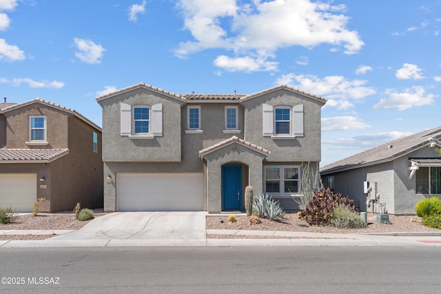 10215 E Bell Rock Trl, Tucson, AZ 85747 - view of front facade with stucco siding, an attached garage, concrete driveway, and a tile roof