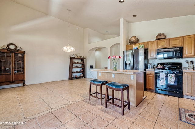 1797 W Naranja Dr, Oro Valley, AZ 85737 - kitchen with black appliances, high vaulted ceiling, a center island, light countertops, and a kitchen breakfast bar