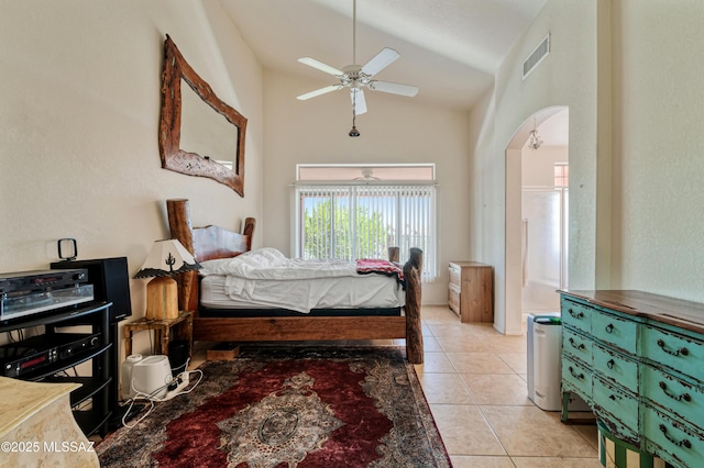 1797 W Naranja Dr, Oro Valley, AZ 85737 - bedroom featuring light tile patterned floors, high vaulted ceiling, arched walkways, and a ceiling fan