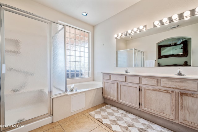 1797 W Naranja Dr, Oro Valley, AZ 85737 - full bathroom featuring a shower stall, a garden tub, tile patterned flooring, connected bathroom, and double vanity