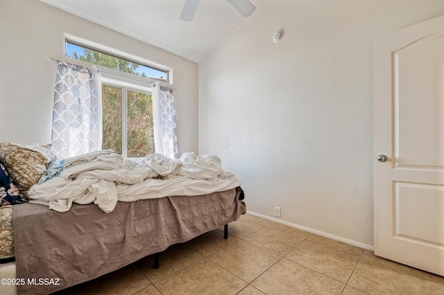 1797 W Naranja Dr, Oro Valley, AZ 85737 - bedroom with lofted ceiling, light tile patterned flooring, baseboards, and ceiling fan