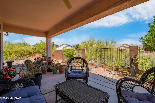 1797 W Naranja Dr, Oro Valley, AZ 85737 - view of patio featuring fence, a ceiling fan, and an outdoor living space
