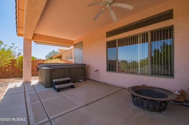 1797 W Naranja Dr, Oro Valley, AZ 85737 - view of patio featuring a hot tub, a fire pit, a ceiling fan, and a fenced backyard