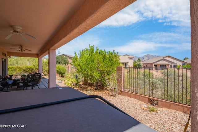 1797 W Naranja Dr, Oro Valley, AZ 85737 - view of patio featuring a ceiling fan, a fenced backyard, a mountain view, and an outdoor living space