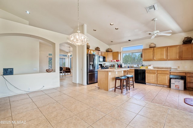1797 W Naranja Dr, Oro Valley, AZ 85737 - kitchen featuring black appliances, arched walkways, light tile patterned floors, ceiling fan, and recessed lighting
