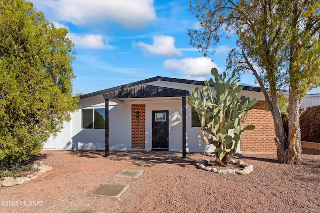 5011 E Scarlett St, Tucson, AZ 85711 - view of front of property with brick siding and stucco siding