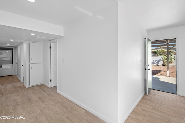 5011 E Scarlett St, Tucson, AZ 85711 - hall with stacked washer / dryer, light wood-style flooring, recessed lighting, and baseboards