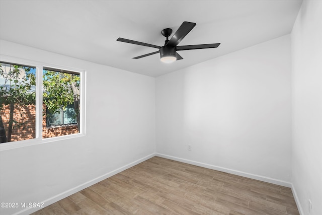 5011 E Scarlett St, Tucson, AZ 85711 - spare room featuring light wood-style floors, baseboards, and a ceiling fan
