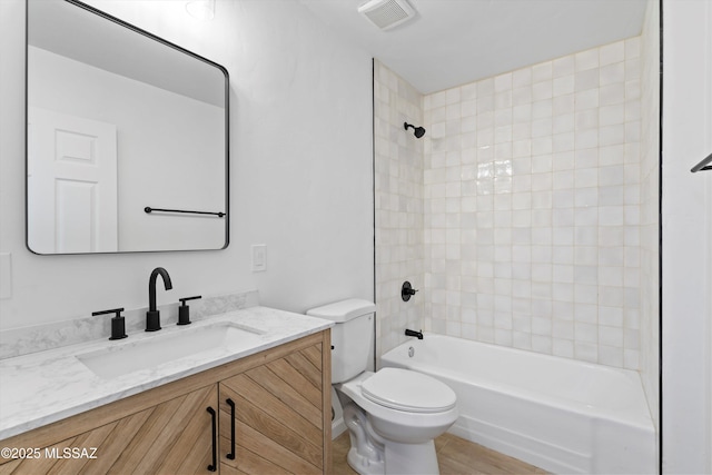 5011 E Scarlett St, Tucson, AZ 85711 - full bath featuring toilet, shower / tub combination, and vanity
