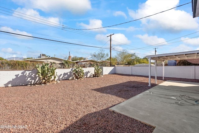5011 E Scarlett St, Tucson, AZ 85711 - fenced backyard with a patio