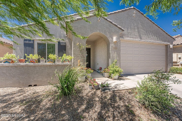 12625 N Wildrose Dr, Marana, AZ 85653 - view of front of house with stucco siding, a tile roof, an attached garage, and concrete driveway