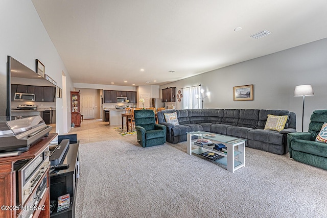 12625 N Wildrose Dr, Marana, AZ 85653 - living room featuring light colored carpet, recessed lighting, and light tile patterned flooring