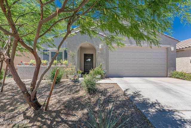 12625 N Wildrose Dr, Marana, AZ 85653 - view of front of property featuring stucco siding, driveway, and a garage