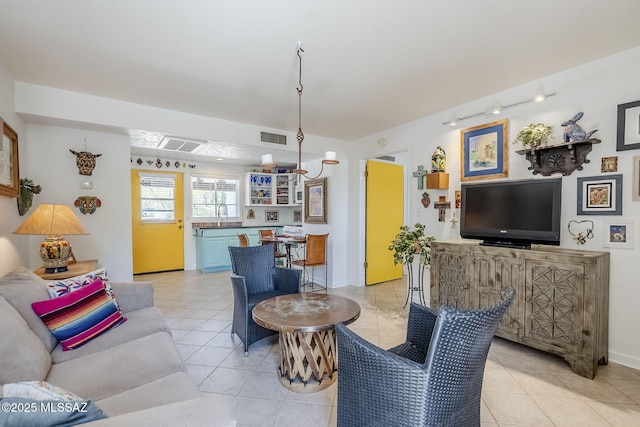 344 S Paseo Sarta Unit C, Green Valley, AZ 85614 - living area featuring light tile patterned floors, track lighting, and baseboards