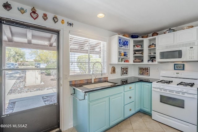 344 S Paseo Sarta Unit C, Green Valley, AZ 85614 - kitchen with white appliances, a sink, healthy amount of natural light, dark countertops, and recessed lighting