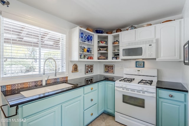 344 S Paseo Sarta Unit C, Green Valley, AZ 85614 - kitchen featuring white appliances, a sink, dark countertops, and plenty of natural light