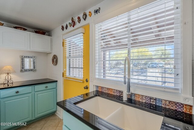 344 S Paseo Sarta Unit C, Green Valley, AZ 85614 - kitchen with a sink, dark countertops, and light tile patterned flooring