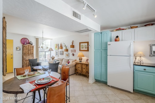 344 S Paseo Sarta Unit C, Green Valley, AZ 85614 - dining area with light tile patterned floors and track lighting