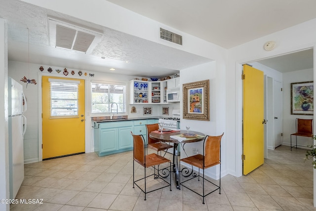 344 S Paseo Sarta Unit C, Green Valley, AZ 85614 - dining room featuring light tile patterned floors and baseboards