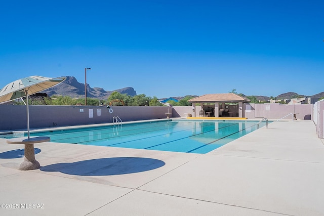 10095 N Mill Crossing Way, Tucson, AZ 85743 - community pool featuring a gazebo and a patio