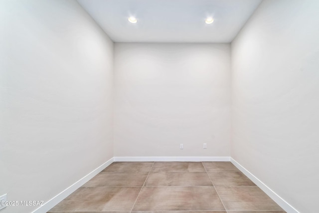 3560 N San Sebastian Dr Unit 12, Tucson, AZ 85750 - spare room with baseboards, concrete floors, and recessed lighting