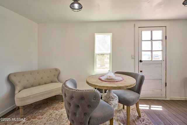 203 N Kellum Ave, Bowie, AZ 85605 - dining area with wood finished floors and baseboards