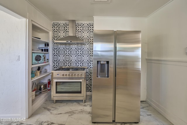 203 N Kellum Ave, Bowie, AZ 85605 - kitchen featuring stainless steel appliances, wall chimney range hood, light marble finish flooring, and crown molding