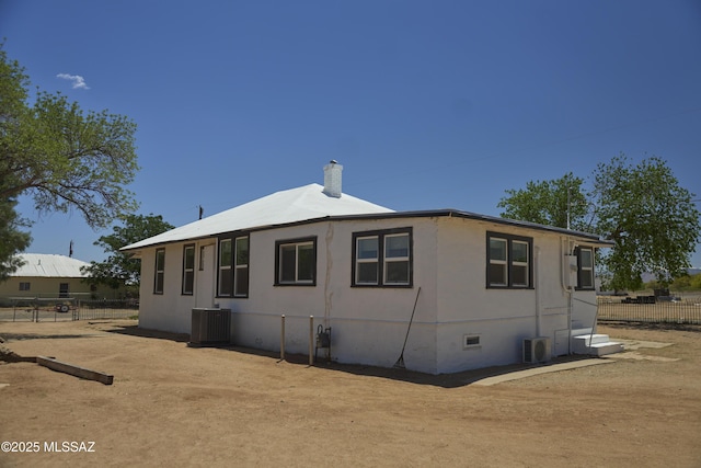 203 N Kellum Ave, Bowie, AZ 85605 - view of property exterior with fence, central AC unit, a chimney, crawl space, and a cooling unit