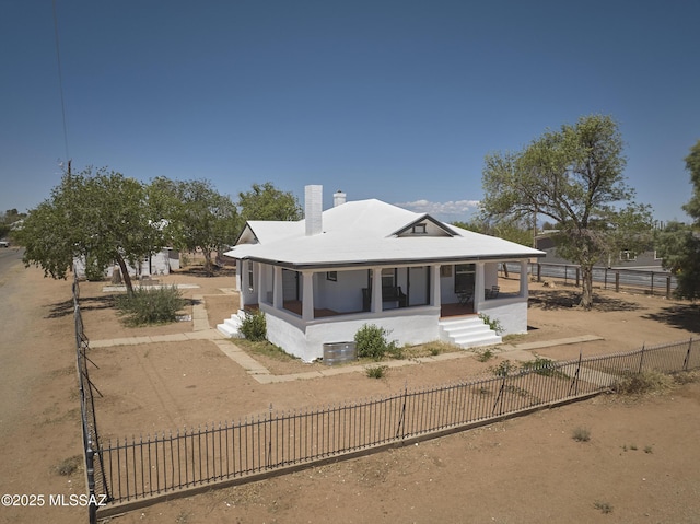 203 N Kellum Ave, Bowie, AZ 85605 - back of house with a porch, a chimney, a fenced front yard, and driveway